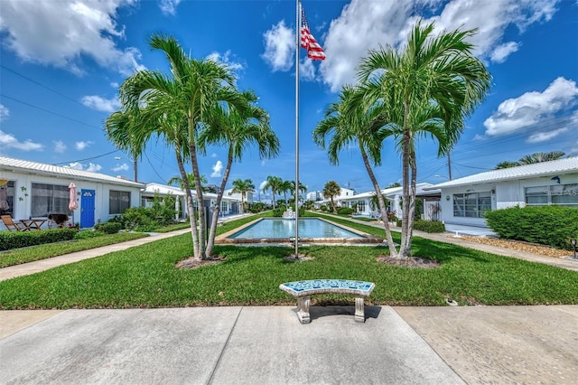 surrounding community with a yard