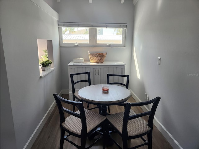 5858 Midnight Pass Rd Unit 27, Sarasota, FL 34242 - dining area featuring dark wood-style flooring and baseboards