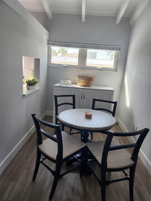 5858 Midnight Pass Rd Unit 27, Sarasota, FL 34242 - dining area with beam ceiling, wood finished floors, and baseboards