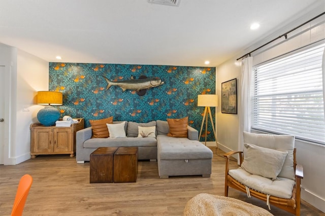 205 71st St Unit B, Holmes Beach, FL 34217 - living room with an accent wall, baseboards, wallpapered walls, light wood-style floors, and recessed lighting