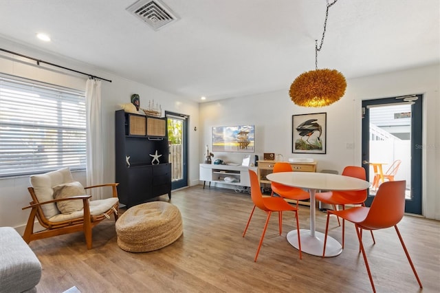 205 71st St Unit B, Holmes Beach, FL 34217 - dining area with light wood finished floors and recessed lighting