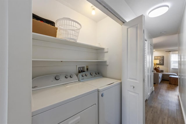 205 71st St Unit B, Holmes Beach, FL 34217 - laundry area with separate washer and dryer and wood-type flooring