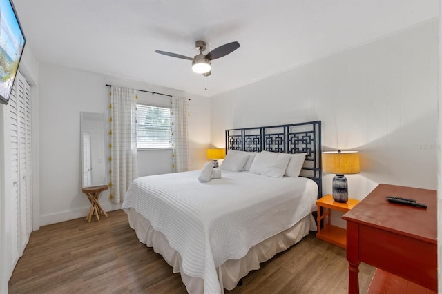 205 71st St Unit B, Holmes Beach, FL 34217 - bedroom with wood finished floors, a ceiling fan, and baseboards