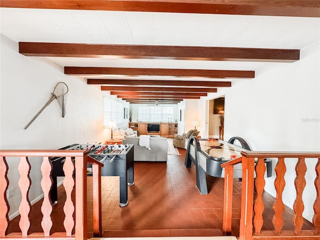 playroom featuring beamed ceiling