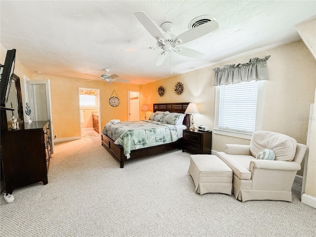 carpeted bedroom featuring ceiling fan and baseboards