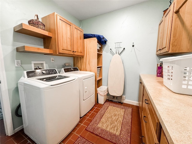 laundry area with washer and dryer and cabinet space