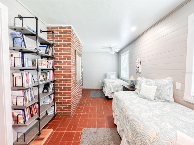 bedroom with brick patterned floors and wooden walls