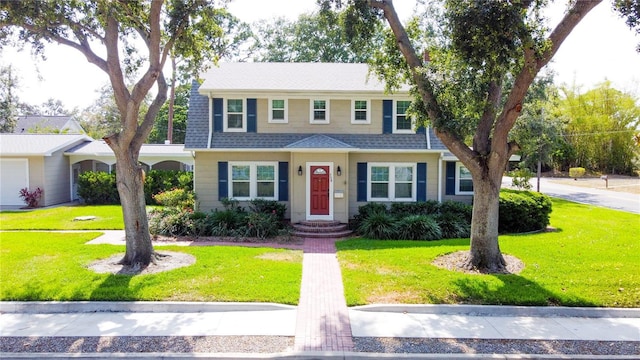 708 32nd St W, Bradenton, FL 34205 - view of front of house with a front yard and a shingled roof