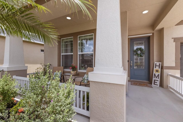 11513 11th Ave E, Bradenton, FL 34212 - doorway to property with covered porch and stucco siding
