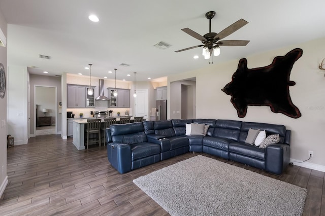 11513 11th Ave E, Bradenton, FL 34212 - living area featuring ceiling fan, wood finished floors, baseboards, and recessed lighting