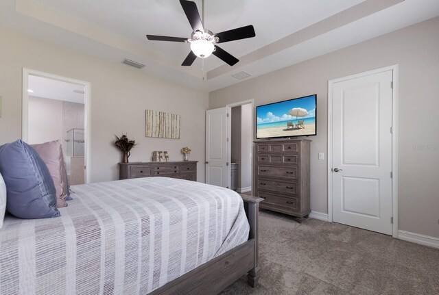 11513 11th Ave E, Bradenton, FL 34212 - bedroom featuring carpet floors, baseboards, ceiling fan, and ensuite bath