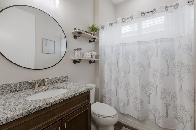 11513 11th Ave E, Bradenton, FL 34212 - bathroom featuring toilet, vanity, and curtained shower