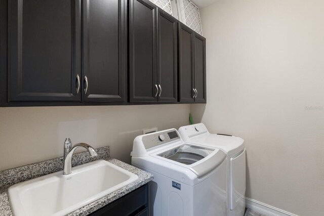 11513 11th Ave E, Bradenton, FL 34212 - clothes washing area featuring washing machine and clothes dryer and cabinet space