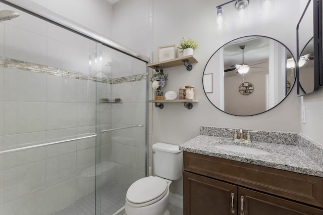 11513 11th Ave E, Bradenton, FL 34212 - bathroom with ceiling fan, a stall shower, toilet, and vanity