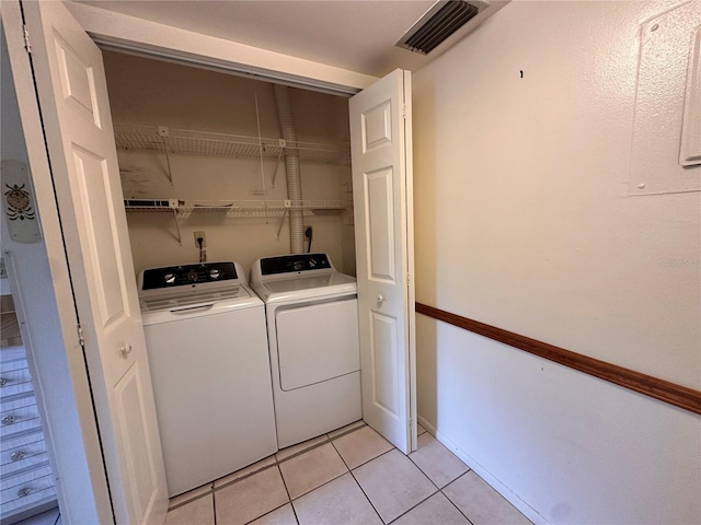 1214 56th St W Unit 1214, Bradenton, FL 34209 - laundry area with separate washer and dryer and light tile patterned flooring