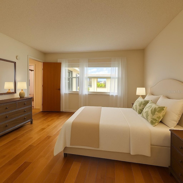 1214 56th St W Unit 1214, Bradenton, FL 34209 - bedroom featuring wood-type flooring and a textured ceiling