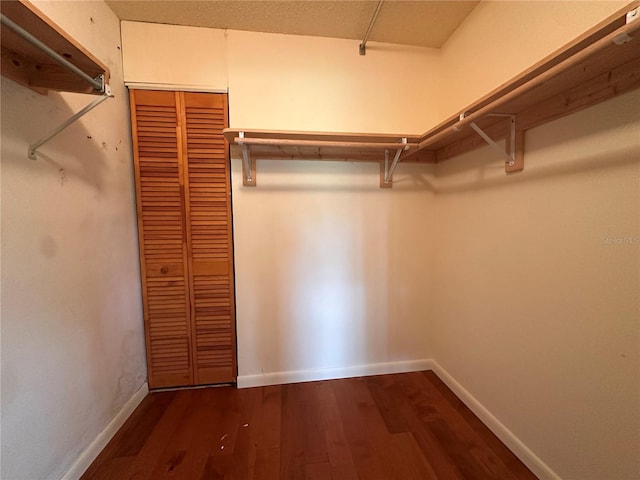 1214 56th St W Unit 1214, Bradenton, FL 34209 - walk in closet with dark wood-type flooring