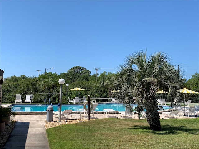 1214 56th St W Unit 1214, Bradenton, FL 34209 - community pool featuring a lawn