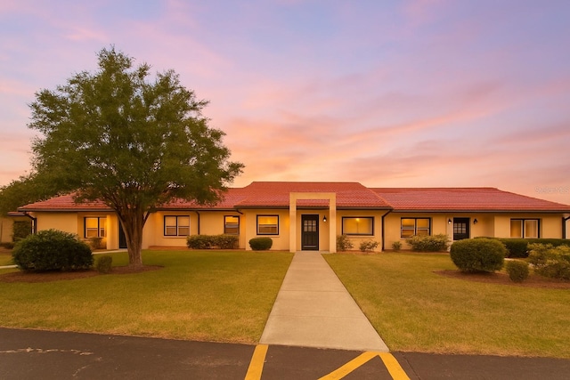 1214 56th St W Unit 1214, Bradenton, FL 34209 - view of front of home featuring a lawn and a tile roof