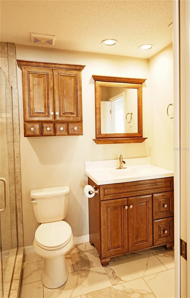 802 Capri Isles Blvd Unit 231, Venice, FL 34292 - full bathroom with marble look tile flooring, a textured ceiling, toilet, vanity, and baseboards