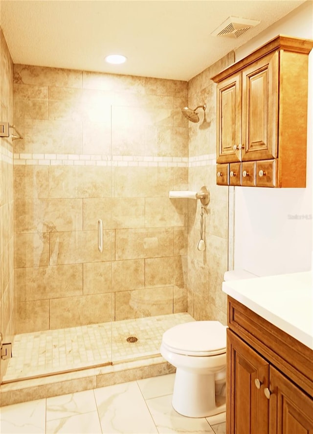 802 Capri Isles Blvd Unit 231, Venice, FL 34292 - bathroom featuring a shower stall, toilet, marble look tile flooring, recessed lighting, and vanity