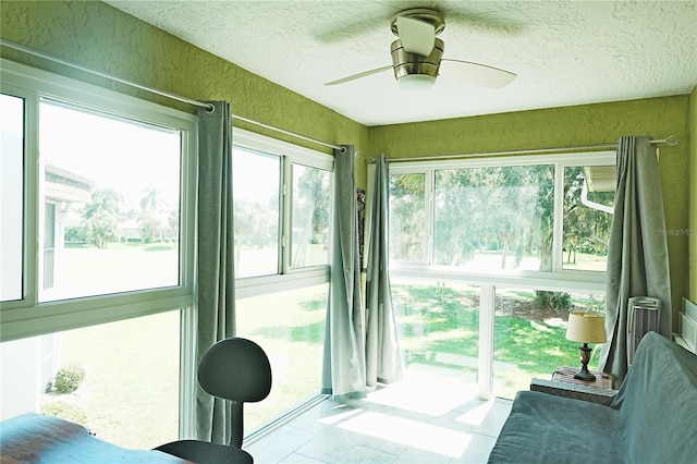 802 Capri Isles Blvd Unit 231, Venice, FL 34292 - sunroom / solarium with a textured ceiling and tile patterned floors