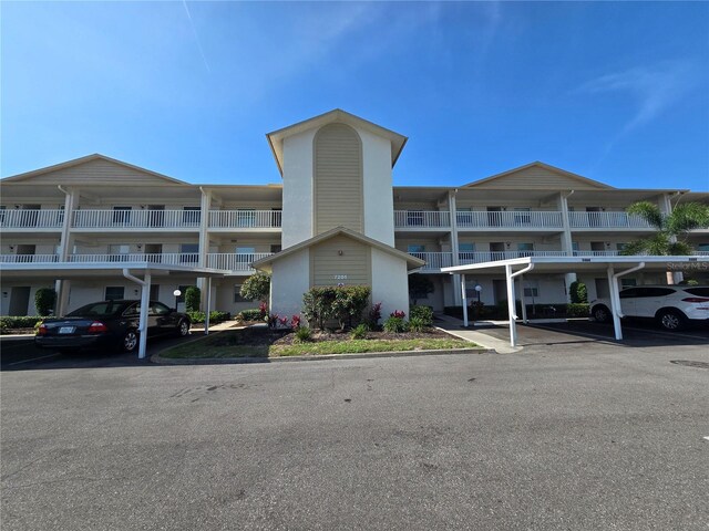 7201 29th Avenue Dr W Unit 306, Bradenton, FL 34209 - view of apartment building / complex featuring covered parking