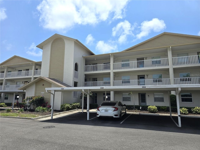 7201 29th Avenue Dr W Unit 306, Bradenton, FL 34209 - view of apartment building / complex featuring covered parking