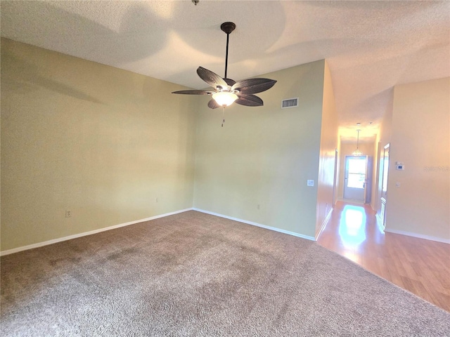 7201 29th Avenue Dr W Unit 306, Bradenton, FL 34209 - carpeted spare room featuring a ceiling fan, a textured ceiling, and baseboards