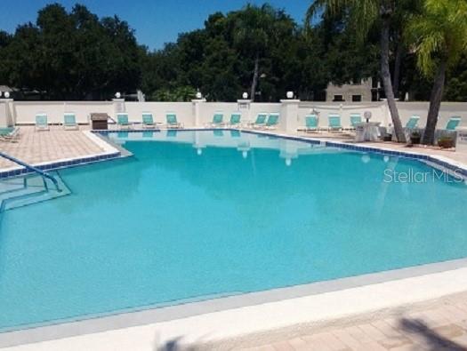 7201 29th Avenue Dr W Unit 306, Bradenton, FL 34209 - community pool with fence and a patio area