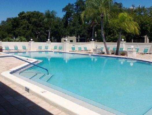7201 29th Avenue Dr W Unit 306, Bradenton, FL 34209 - community pool featuring fence and view of scattered trees