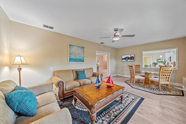 1432 Colony Pl, Venice, FL 34292 - living room with wood finished floors, baseboards, and ceiling fan