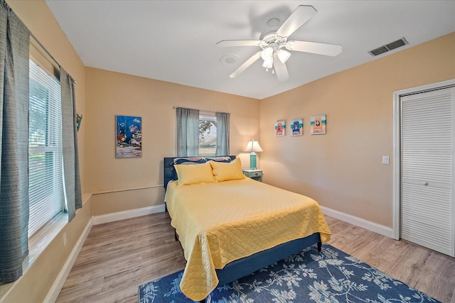 1432 Colony Pl, Venice, FL 34292 - bedroom with wood finished floors, baseboards, ceiling fan, and a closet