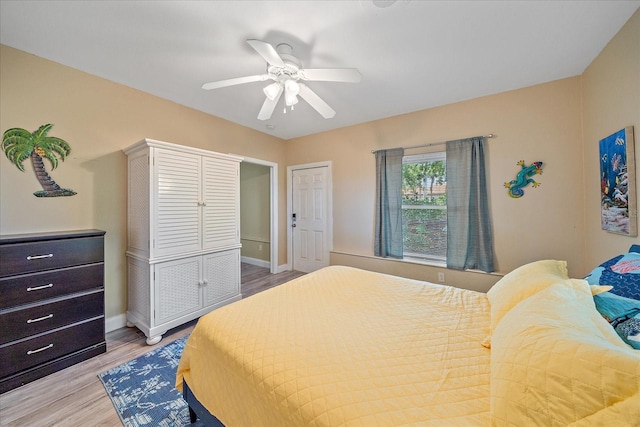 1432 Colony Pl, Venice, FL 34292 - bedroom with light wood-style flooring, ceiling fan, and baseboards