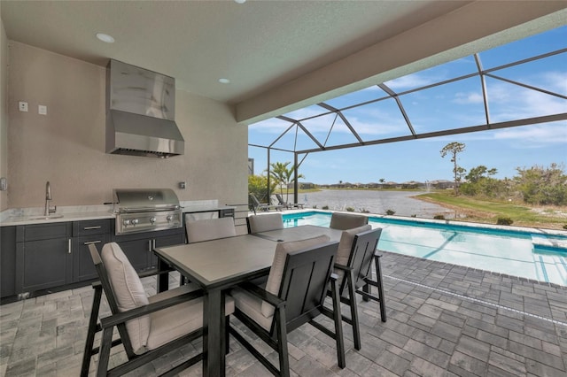 view of patio / terrace featuring area for grilling, an outdoor pool, a sink, and glass enclosure