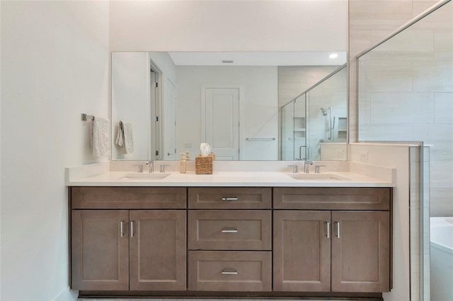 bathroom with a stall shower, double vanity, and a tub