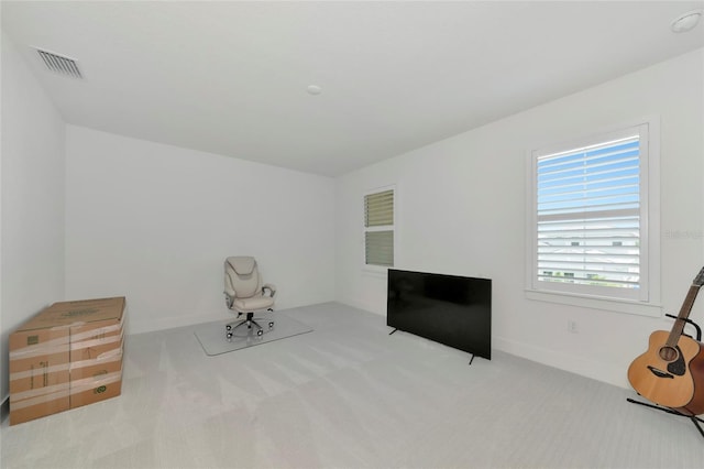 unfurnished room featuring carpet and baseboards