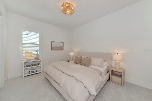carpeted bedroom with baseboards