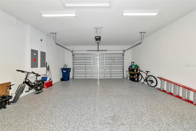 garage with electric panel and a garage door opener