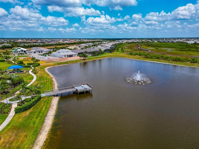 aerial view of residential area featuring a large body of water