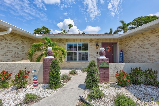 view of exterior entry with an attached garage