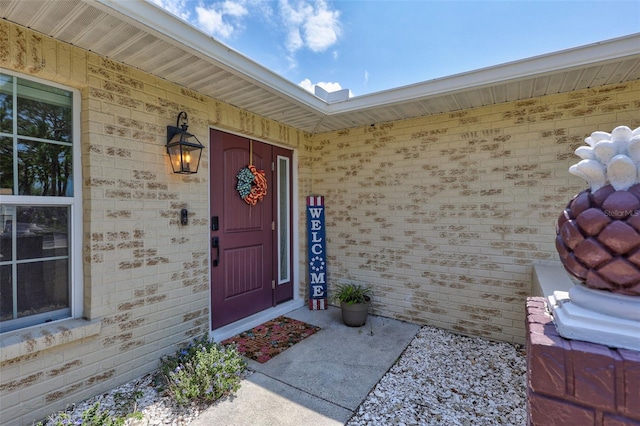 entrance to property with brick siding