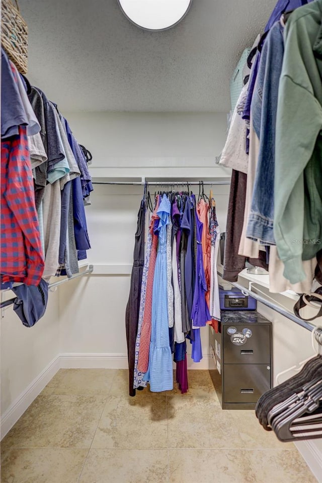 spacious closet with tile patterned flooring