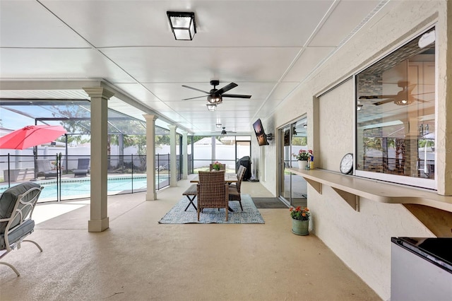 sunroom / solarium with ceiling fan