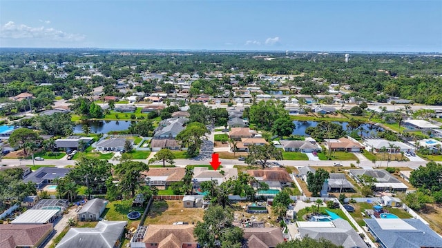 aerial view of residential area featuring a nearby body of water