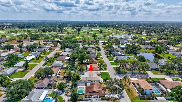 view of property location with a nearby body of water and nearby suburban area