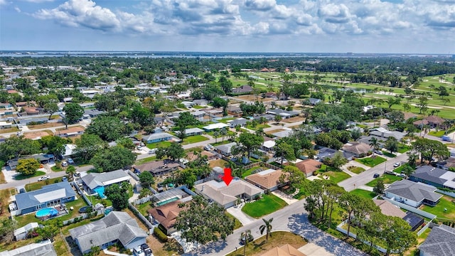 aerial view of property's location with nearby suburban area