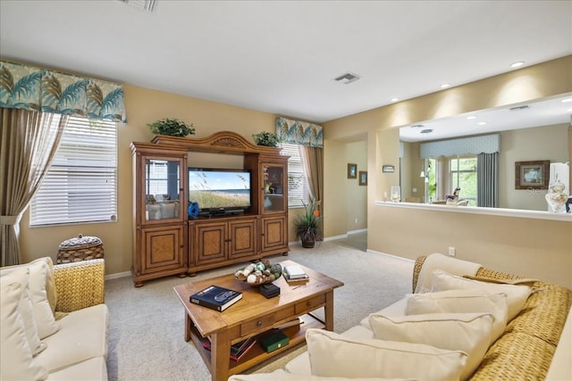 13180 SW Pembroke Cir N, Lake Suzy, FL 34269 - carpeted living room with baseboards