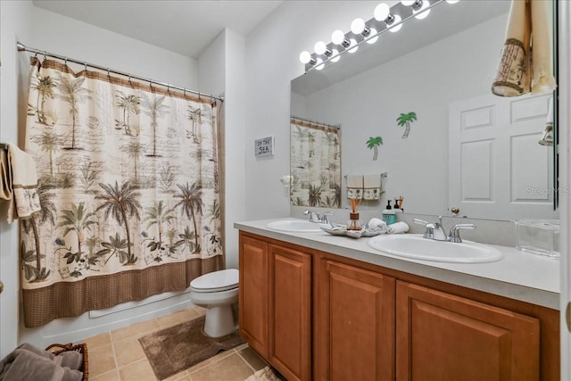 13180 SW Pembroke Cir N, Lake Suzy, FL 34269 - bathroom featuring tile patterned floors, toilet, double vanity, and shower / bath combination with curtain
