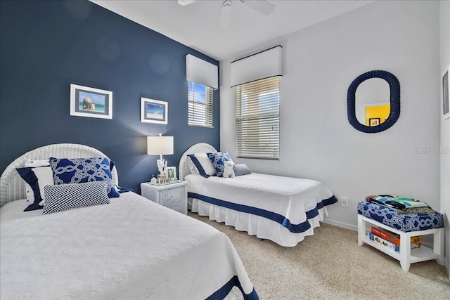 13180 SW Pembroke Cir N, Lake Suzy, FL 34269 - bedroom with carpet floors, baseboards, and ceiling fan